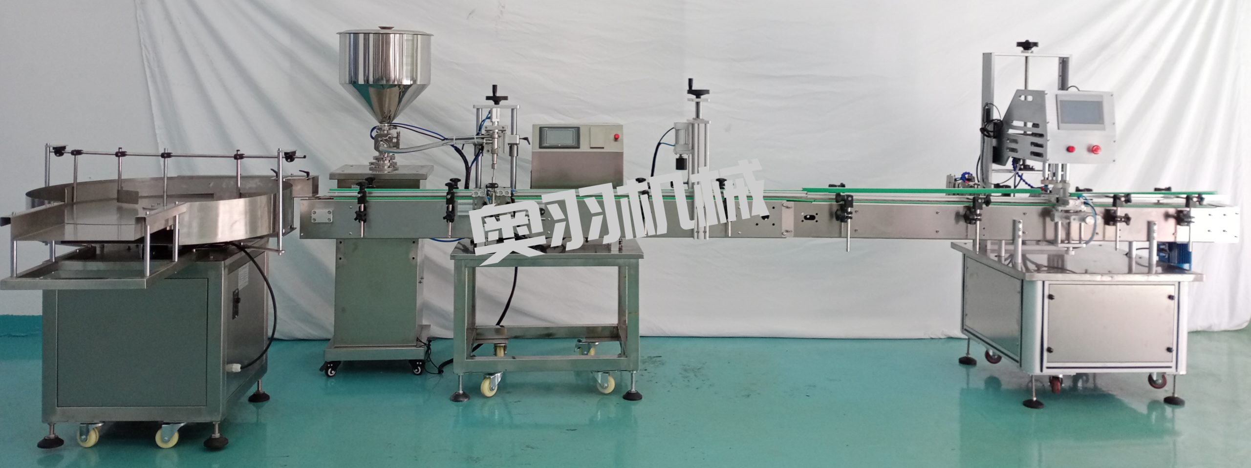 小型液體自動(dòng)灌裝旋蓋流水線(xiàn)_瓶裝灌裝生產(chǎn)線(xiàn)系列_第1張_石家莊奧羽自動(dòng)化設(shè)備有限公司 小型液體自動(dòng)灌裝旋蓋流水線(xiàn)_http://www.lntfjy.com_瓶裝灌裝生產(chǎn)線(xiàn)系列_第1張